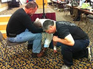 Bi-vocational pastors praying for each other at a conference in Pigeon Forge, TN.